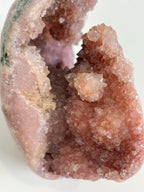 Beautiful pink amethyst freeform specimen showcasing sparkling crystal formations and natural textures.