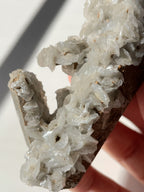 Beautiful flower calcite specimen with intricate crystal formations, showcasing natural textures and colors.