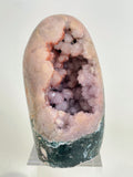 Beautiful botryoidal pink amethyst freeform with sparkling crystal clusters, displayed on a clear stand.
