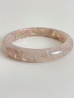 Beautiful flower agate bangle with soft pink hues and floral patterns, showcasing its unique crystal design.