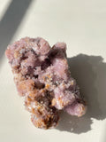 Beautiful purple creedite crystal specimen with sparkling textures and earthy tones, showcasing its natural beauty.