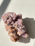 Beautiful purple creedite crystal specimen with sparkling textures and earthy tones, showcasing its natural beauty.
