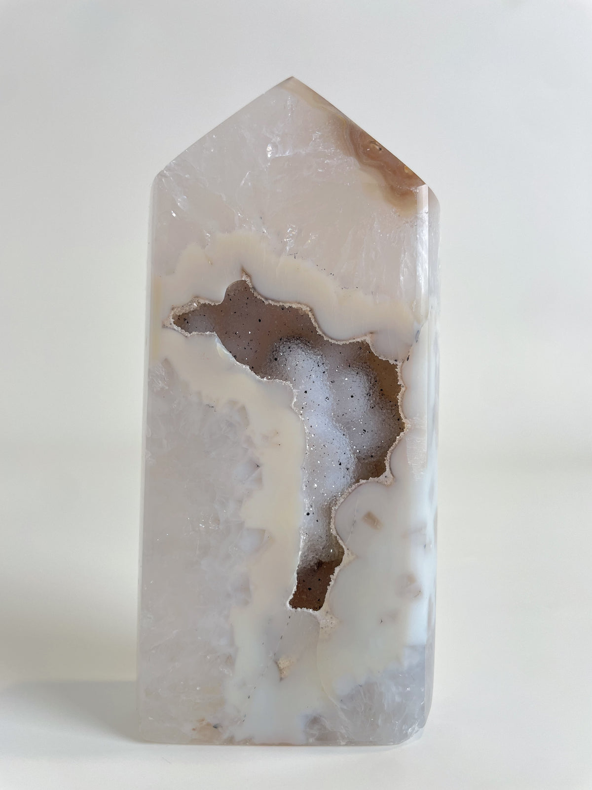 Druzy Agate Tower with a smooth, polished surface showcasing natural patterns and colors, highlighting its crystal beauty.