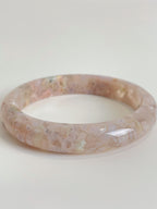 Beautiful flower agate bangle showcasing soft pink hues and intricate patterns, perfect for stylish accessorizing.