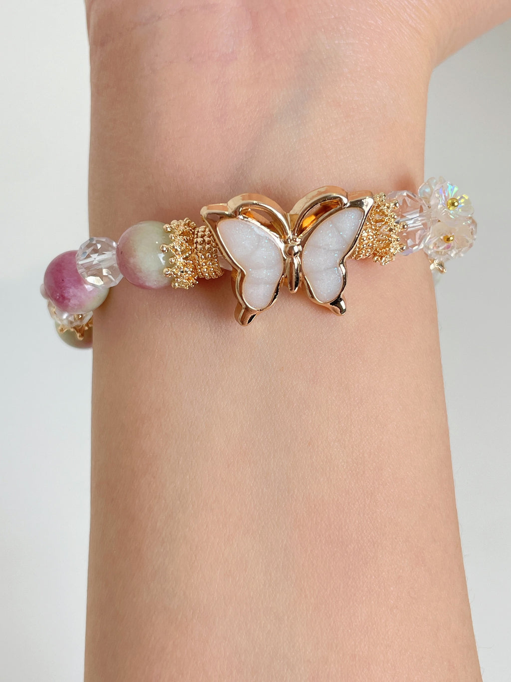 Beautiful watermelon chalcedony bracelet featuring a butterfly clasp and sparkling crystal accents.