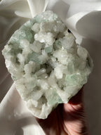 Beautiful crystal specimen featuring green apophyllite and stilbite, showcasing intricate formations and textures.
