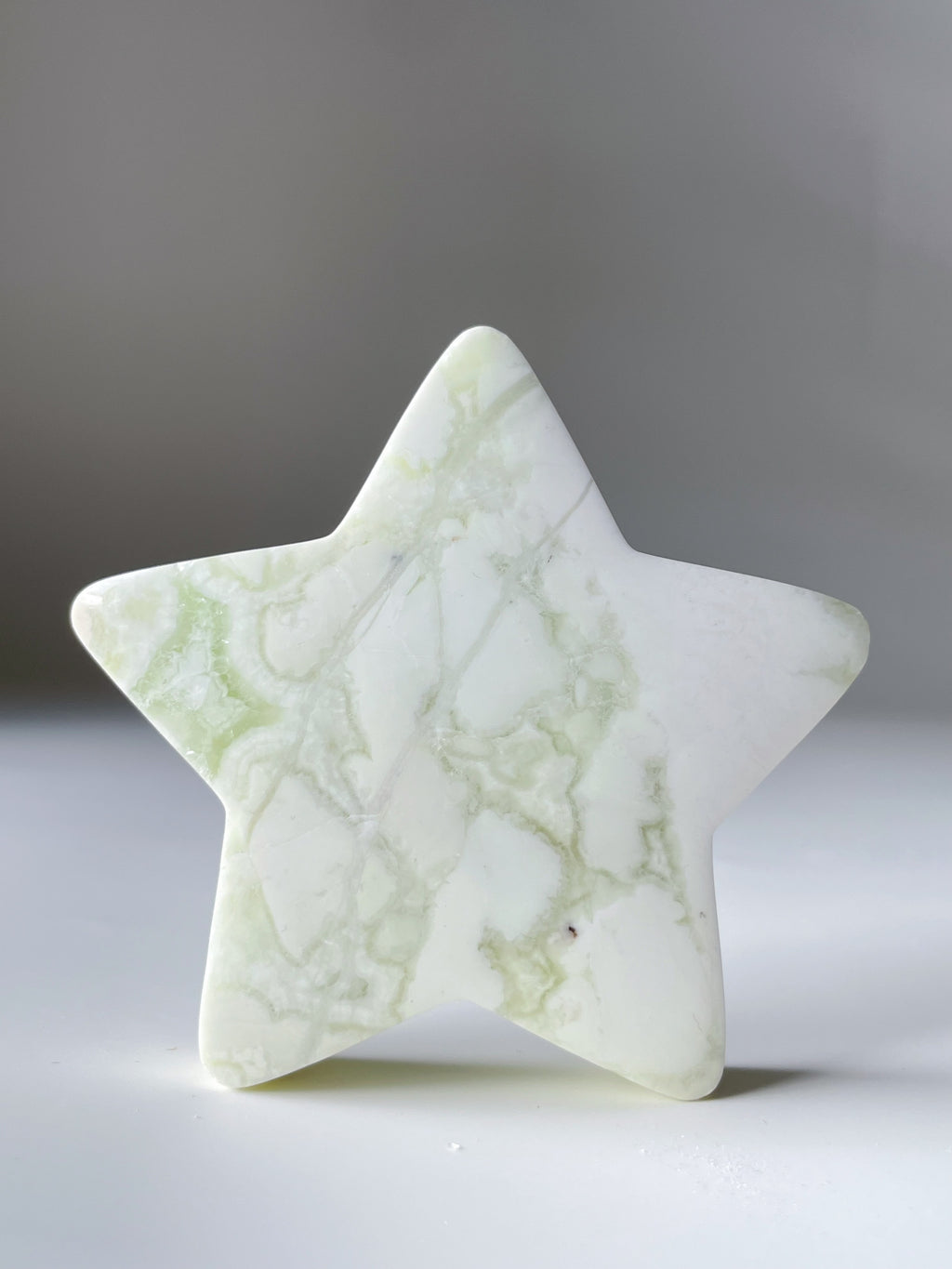 Green Maligano Jasper star with a smooth surface and subtle marbling, showcasing its natural beauty.