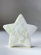 Green Maligano Jasper star with a smooth surface and subtle marbling, showcasing its natural beauty.